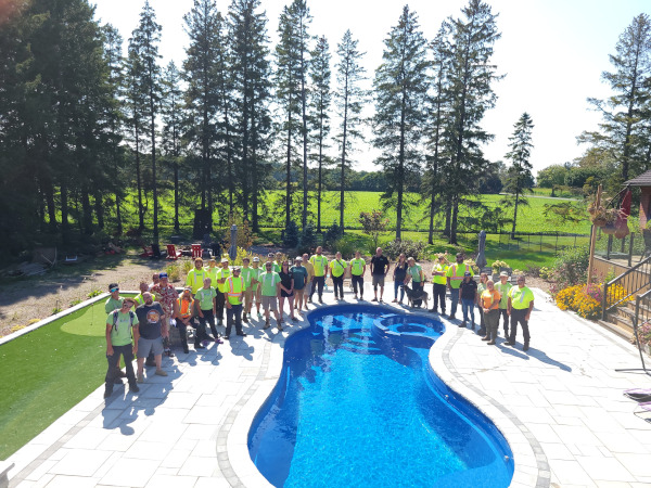 team photo shoot after installing an outdoor pool